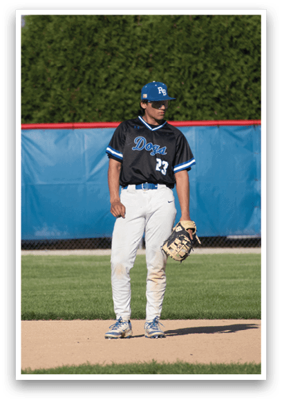 A baseball player wearing a black shirt with the number 17 on it. Description generated by AI