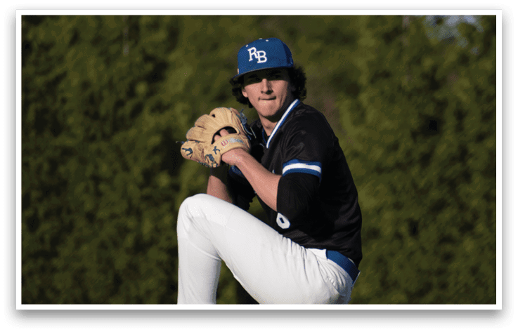 A baseball player in a black shirt and white pants is in the process of throwing a ball. Description generated by AI