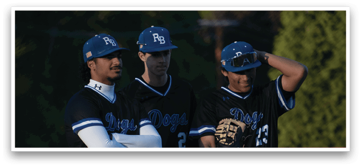 Three baseball players standing on a field. Description generated by AI