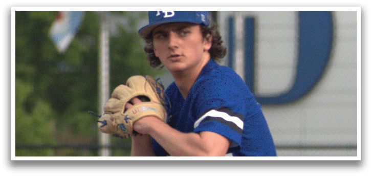 A baseball player in a blue and white uniform is pitching a ball. Description generated by AI