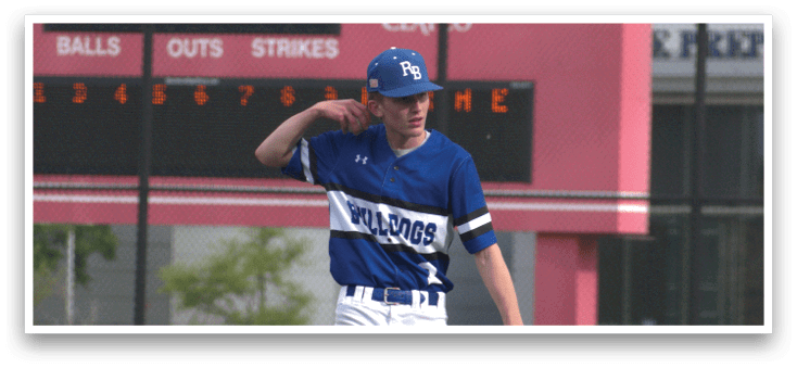 A baseball player wearing a blue and white uniform. Description generated by AI
