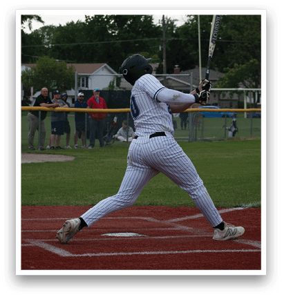 A baseball player is swinging a bat at a ball. Description generated by AI