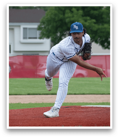 A baseball pitcher in a blue hat and white uniform is throwing a pitch. Description generated by AI