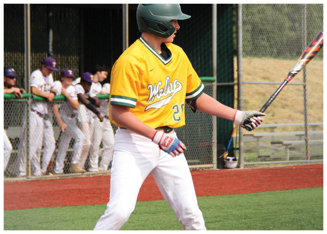 A baseball player in a yellow jersey is holding a bat and preparing to swing. AI generated content