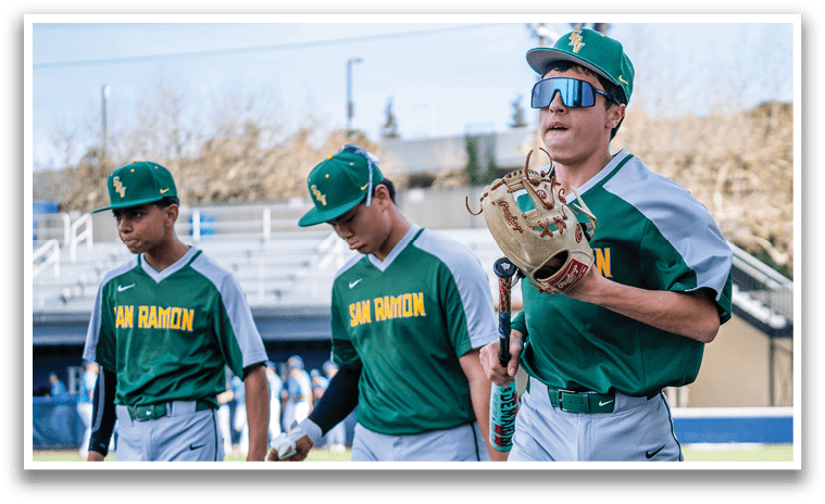 Three baseball players walking on the field, two of them wearing green and white uniforms. AI generated content