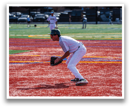 A baseball player in a white uniform is crouching on the field, holding a baseball glove. AI generated content