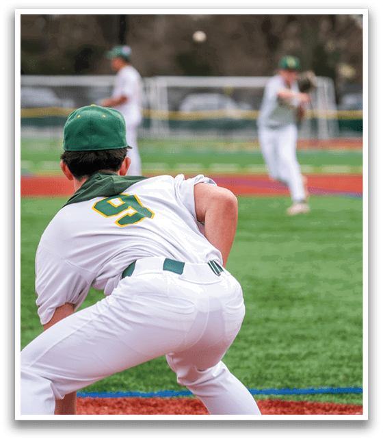 A baseball player in a white uniform is crouching on the field, ready to catch the ball. AI generated content