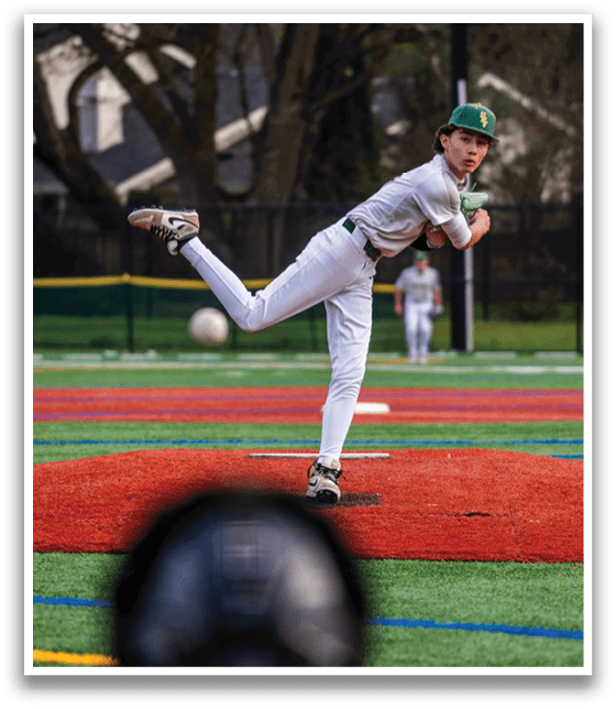 A baseball player in a white uniform is pitching a ball on a field. AI generated content
