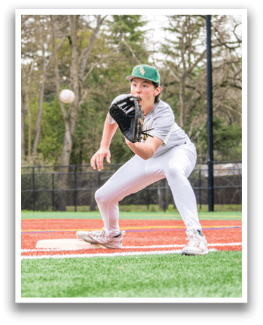 A baseball player in a grey uniform is catching a ball with his glove. AI generated content