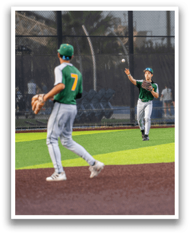 Three baseball players are on the field, one of them is wearing a green shirt and yellow shorts. They are all holding baseball gloves, preparing to catch the ball. AI generated content