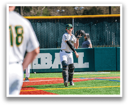 A baseball player in a white uniform is standing on the field, holding a baseball glove. AI generated content