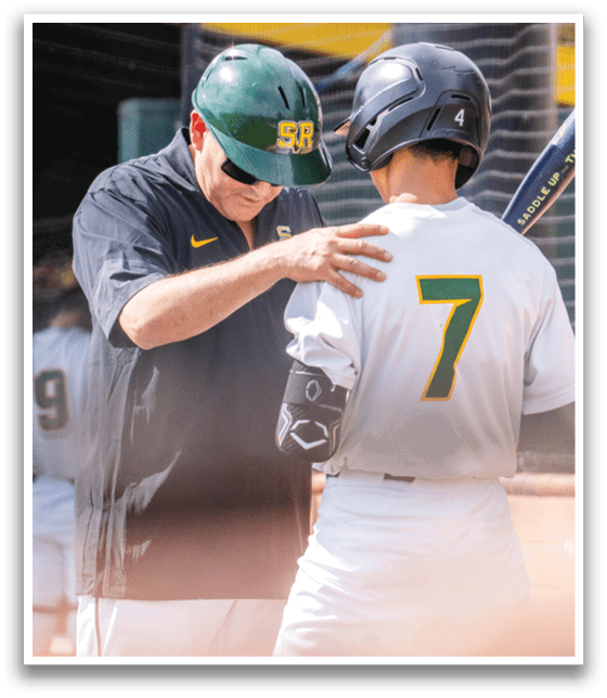 Two men in baseball uniforms are talking to each other. One man is wearing a helmet and holding a bat. AI generated content