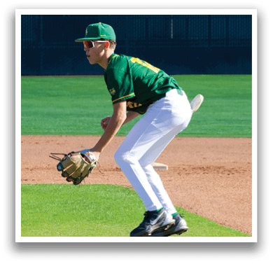 A baseball player in a green and yellow uniform is catching a ball with his glove. AI generated content