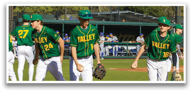 Baseball players wearing green and yellow uniforms are walking on the field. AI generated content