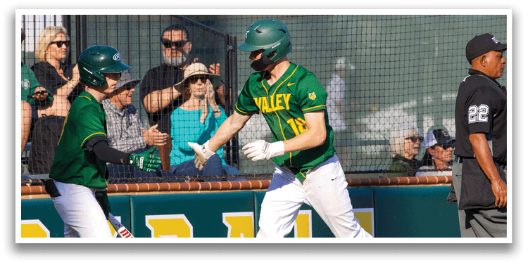 Two baseball players are high-fiving each other on the field. AI generated content