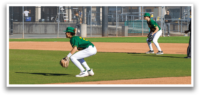 A baseball player is crouching on the field, wearing a green and yellow uniform. AI generated content