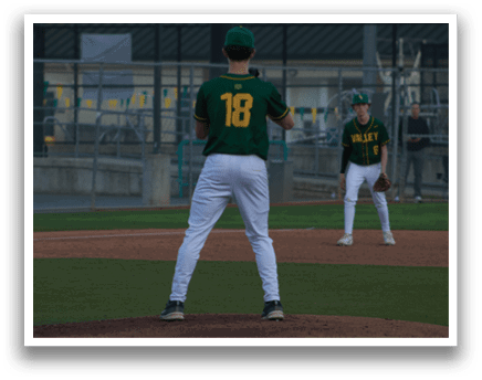A baseball player in a green and yellow uniform stands on the pitcher's mound, holding a baseball glove. AI generated content