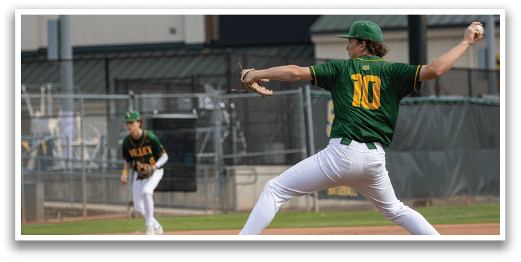 A baseball player in a green and yellow uniform is in the process of throwing a ball. AI generated content