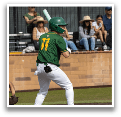 A baseball player in a green and yellow jersey is holding a bat and getting ready to swing. AI generated content