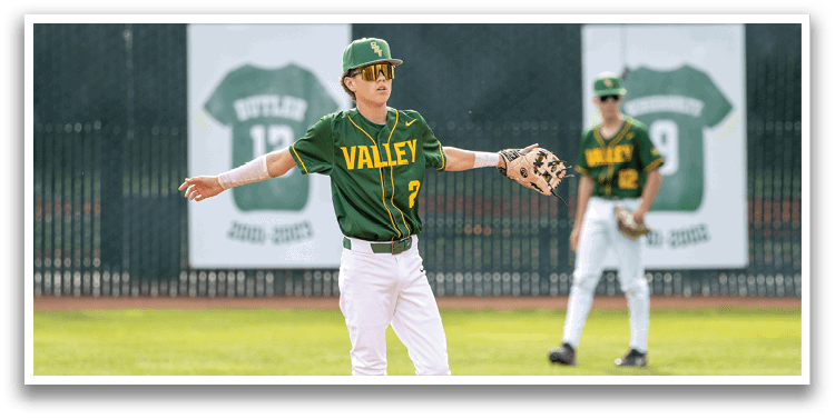 A boy in a green and yellow baseball uniform is throwing a ball. AI generated content