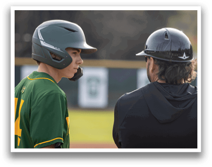 Two men wearing baseball helmets and uniforms are standing on a field. AI generated content