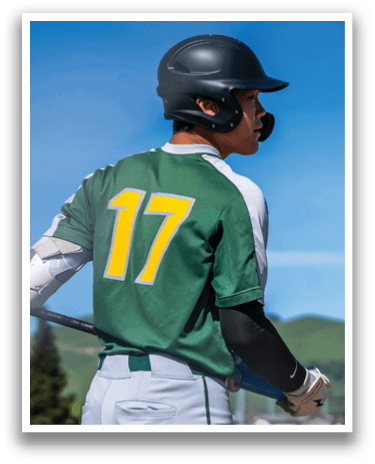 A baseball player wearing a green and yellow jersey with the number 17 on the back. AI generated content