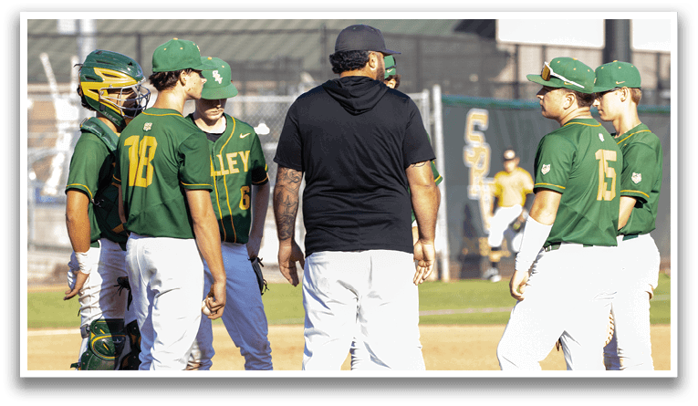 Baseball players wearing green and yellow uniforms. Description generated by AI