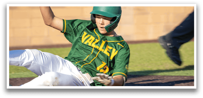 A baseball player sliding into a base. Description generated by AI