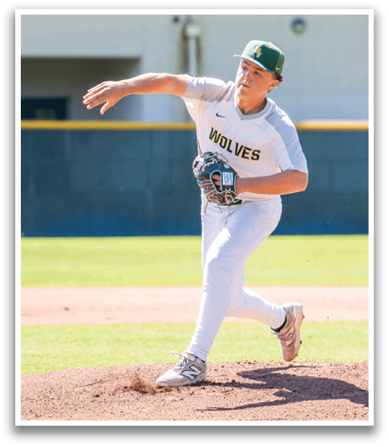 A baseball player in a white uniform is pitching a ball. Description generated by AI