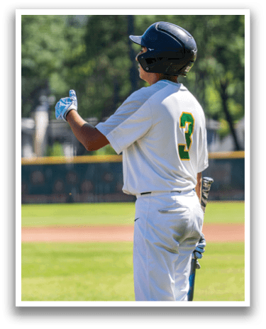 A baseball player wearing a helmet and holding a bat. Description generated by AI