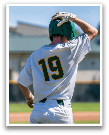 A baseball player wearing a white jersey with the number 19 on the back. Description generated by AI