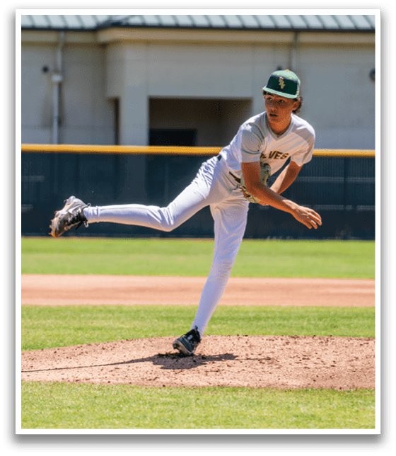 A baseball player in a white uniform is pitching a ball. Description generated by AI