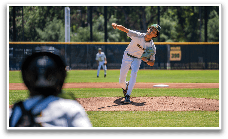 A baseball player in a white uniform is pitching a ball. Description generated by AI