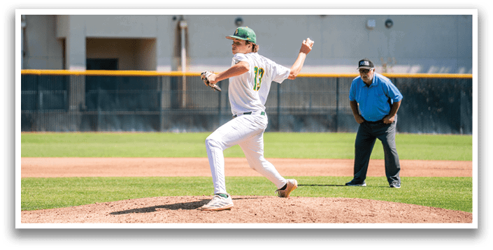 A baseball player in a green and white uniform is pitching a ball. Description generated by AI