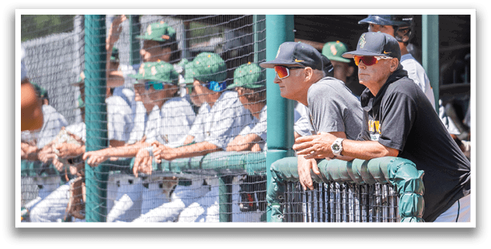 A group of baseball players sitting on a bench. Description generated by AI