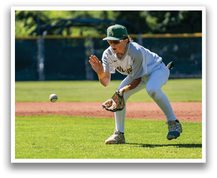 A baseball player catching a ball. Description generated by AI