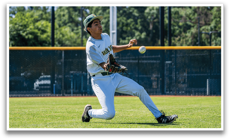 A baseball player catching a ball. Description generated by AI