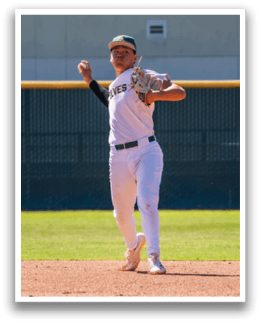 A baseball player in a white uniform is throwing a ball. Description generated by AI