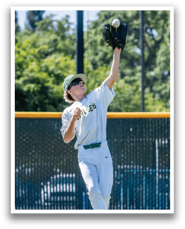 A baseball player catching a ball. Description generated by AI