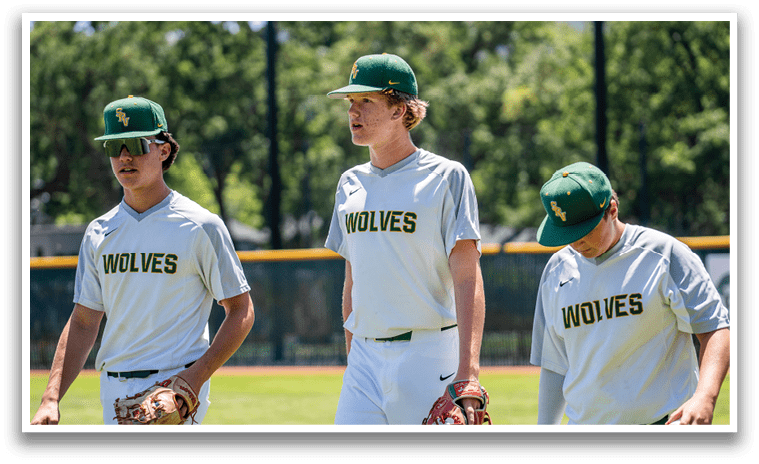 Three baseball players wearing white shirts with the word wolves on them. Description generated by AI