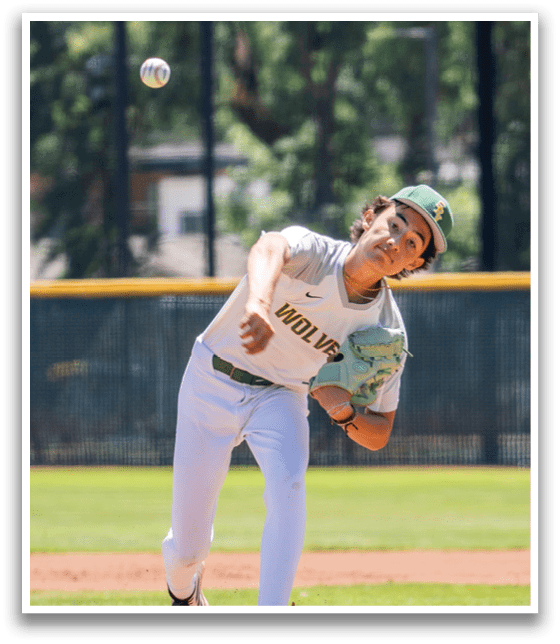 A baseball player in a green and white uniform is pitching a ball. Description generated by AI