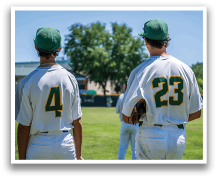 Two baseball players wearing number 4 and 23 standing on a field. Description generated by AI