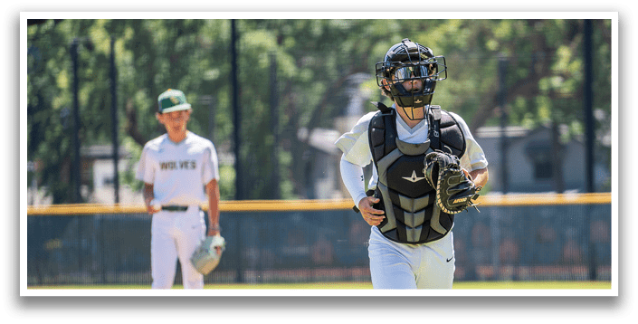 A baseball player wearing a green helmet and a white uniform. Description generated by AI