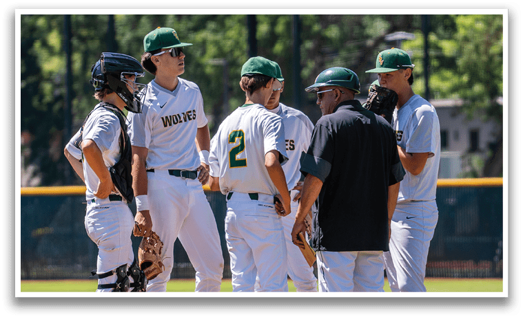 A group of baseball players wearing white uniforms. Description generated by AI