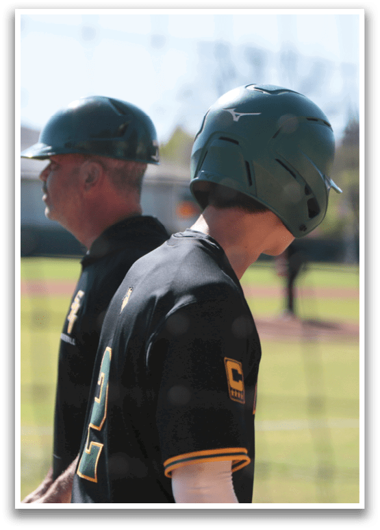 Two baseball players wearing helmets and uniforms are standing on a field. AI generated content