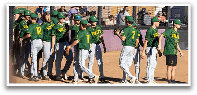 A group of young men in green and yellow uniforms are standing on a baseball field. They are holding baseball gloves and are likely waiting for their turn to play. AI generated content