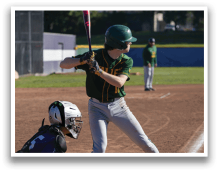 A baseball player in a green and yellow uniform is swinging a bat, attempting to hit a ball. AI generated content