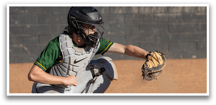 A baseball player wearing a helmet and catcher's mitt is kneeling on the ground. AI generated content