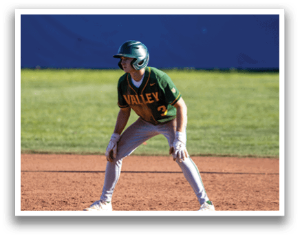 A baseball player is crouching on the field, wearing a green and yellow jersey. AI generated content