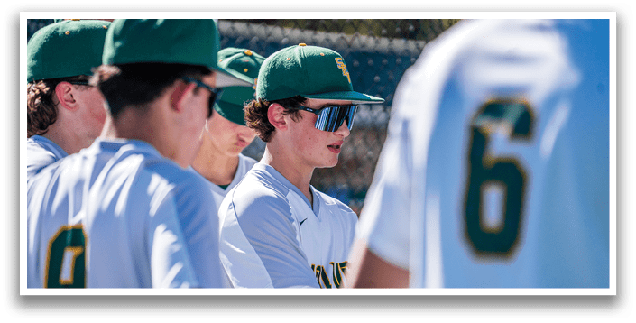 A group of baseball players wearing green and white uniforms are standing on the field. AI generated content